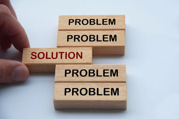 words problem and solution printed on wooden blocks