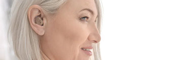 Lady wearing over the counter hearing aid