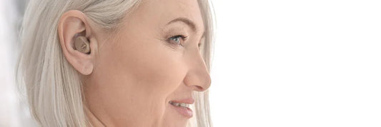 Lady wearing over the counter hearing aid
