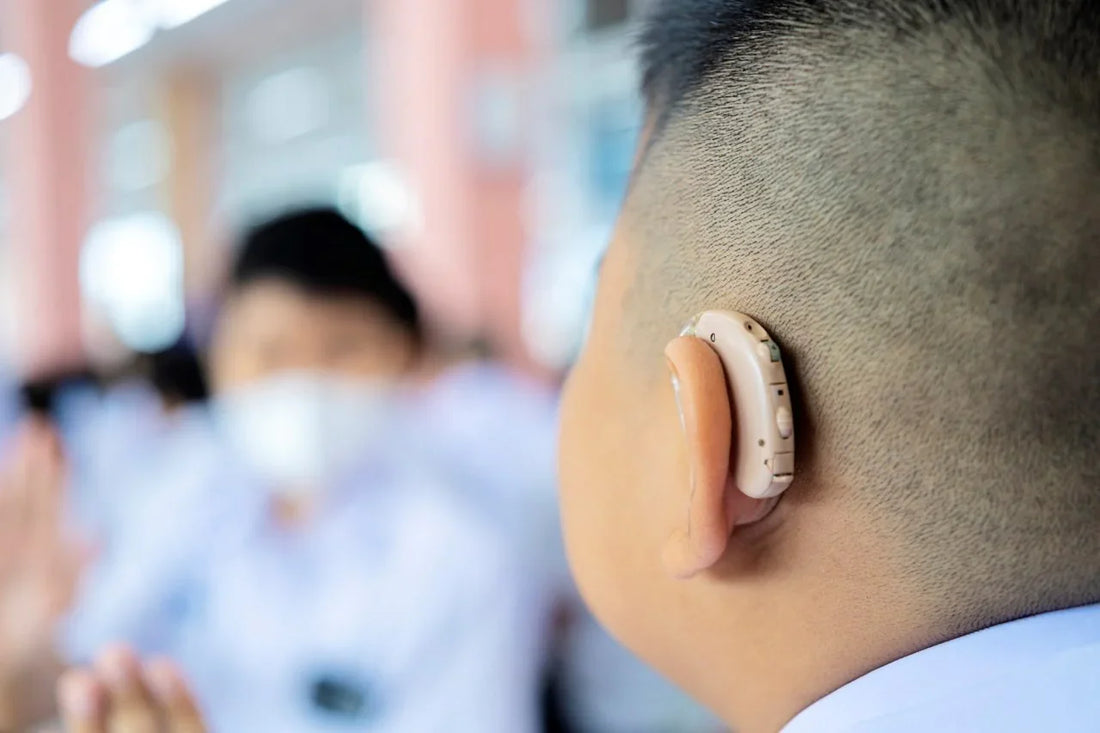 kid with hearing aid