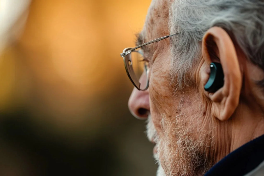old man wearing digital hearing aids