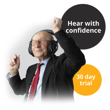 Elderly customer enjoying the sounds of music, dancing while using his Hear Clear Hearing Aids